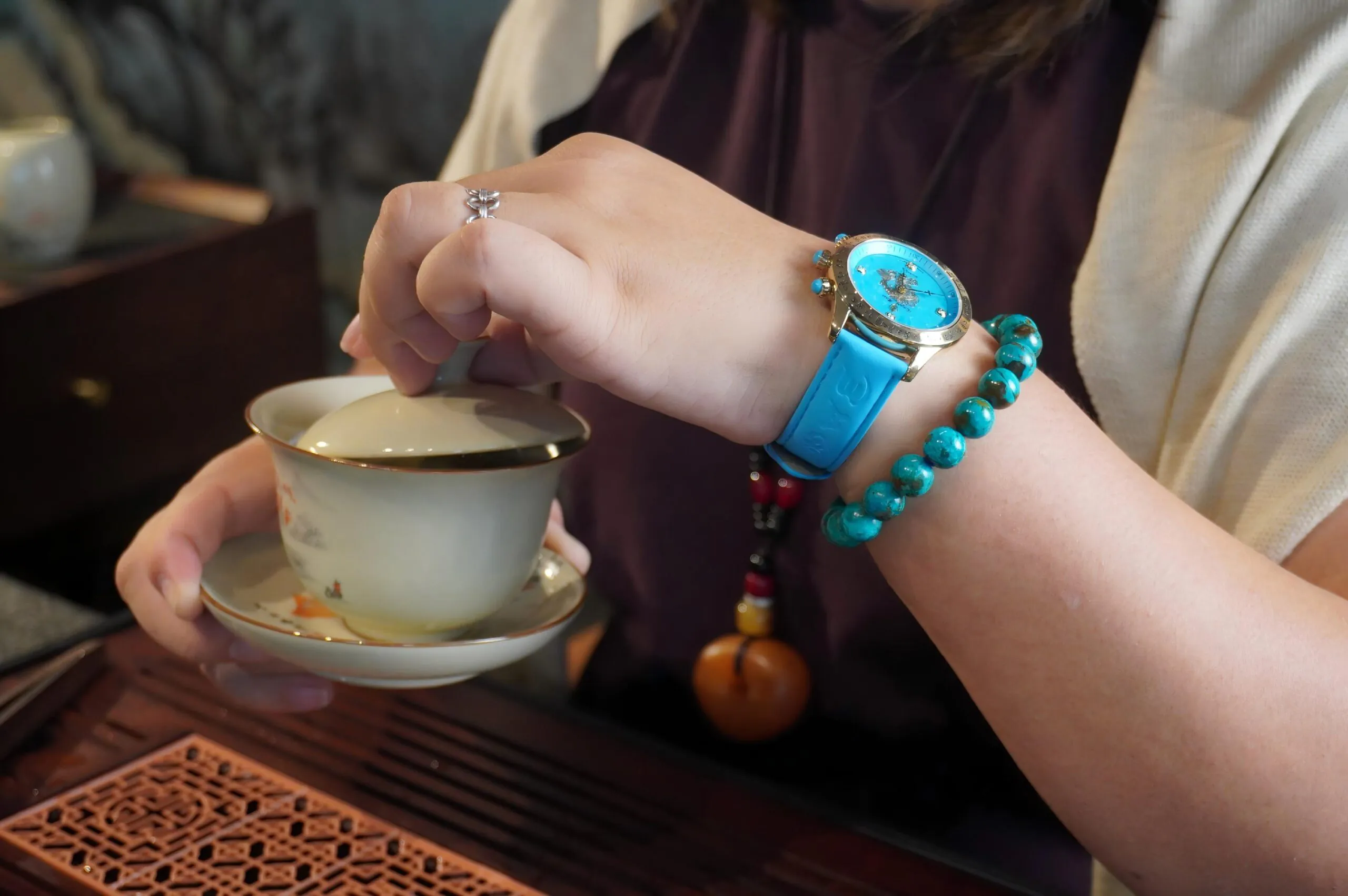 Woman wearing the Royal Muse Zakiram turquoise dial watch