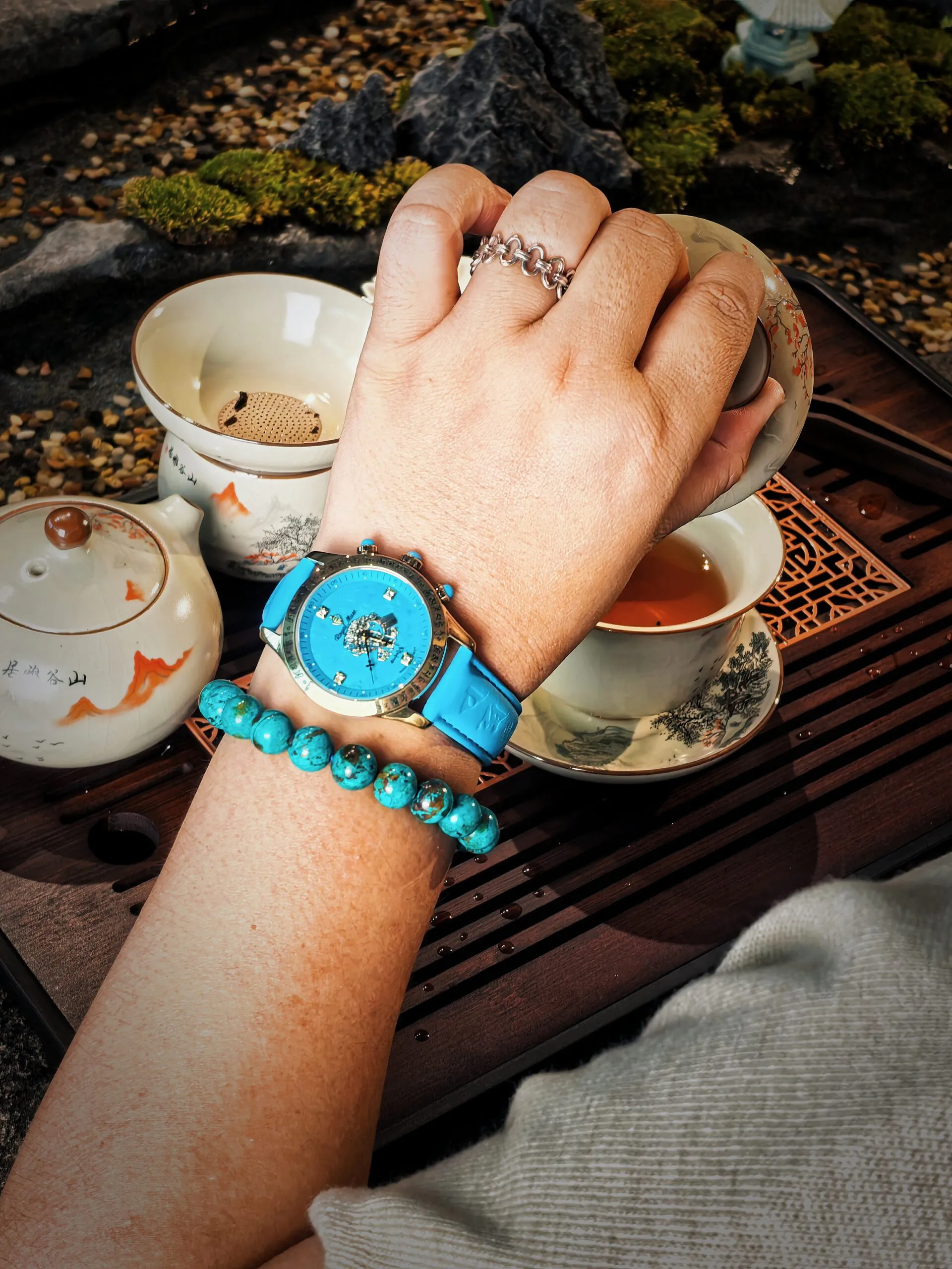 Woman wearing the Royal Muse Zakiram turquoise dial watch
