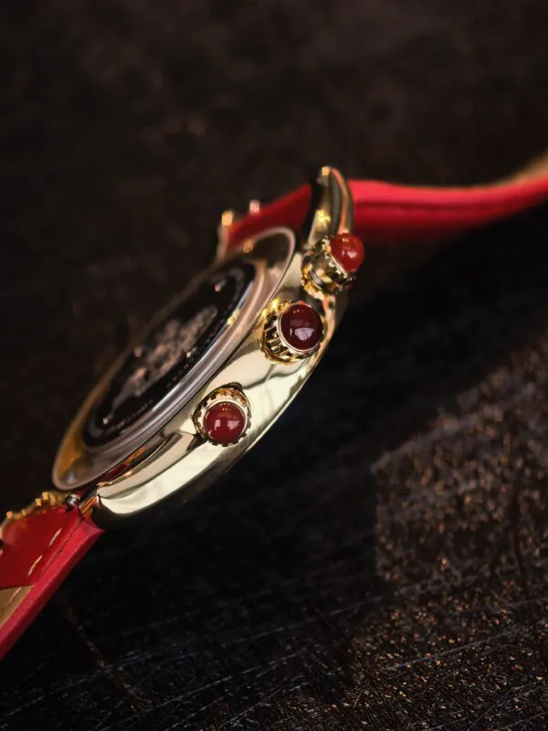 Zakiram Watch Side and Crown Detail Royal Muse Zakiram watch side view with red cabochon crown details