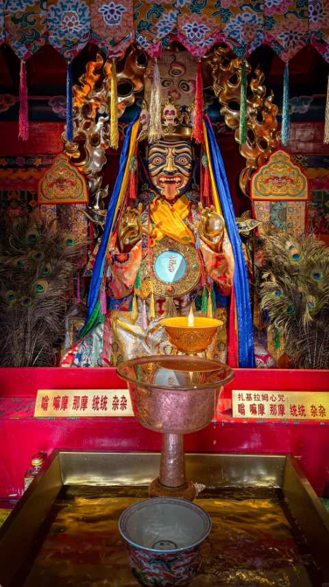 Zakiram statue in a Tibetan temple setting, cultural inspiration for the Royal Muse watch collection